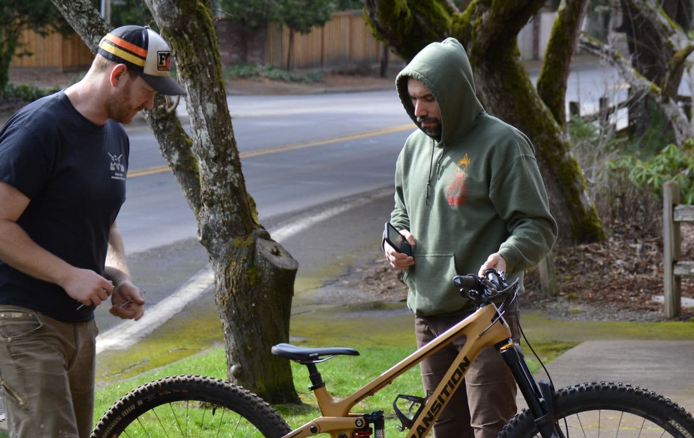 Dan Shell looking over a bike with a Shell Bike customer